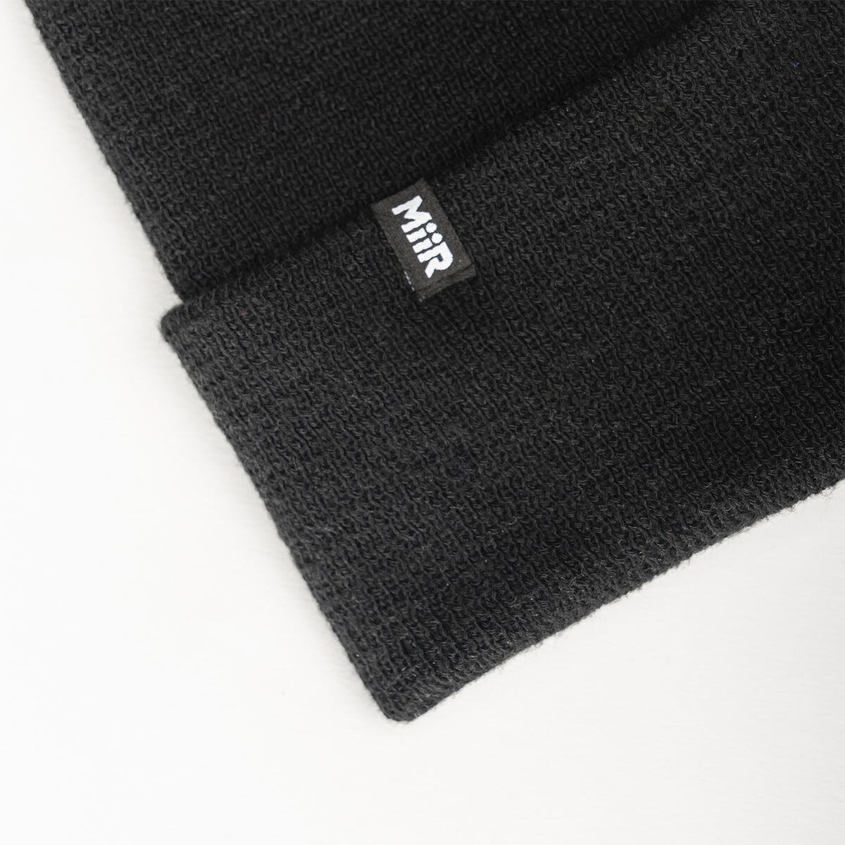 recycled-poly-fine-knit-beanie-y0 WebPDP-RecycledPolyFineKnitBeanie_Studio_TagDetail_Black__BNE005002OS.jpg