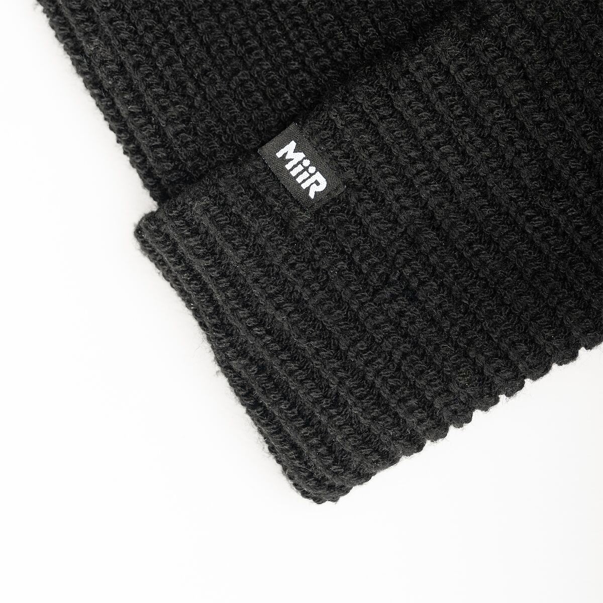 recycled-poly-rib-beanie-k4 WebPDP-RecycledPolyRibBeanie_Studio_TagDetail_Black__BNE002002OS.jpg